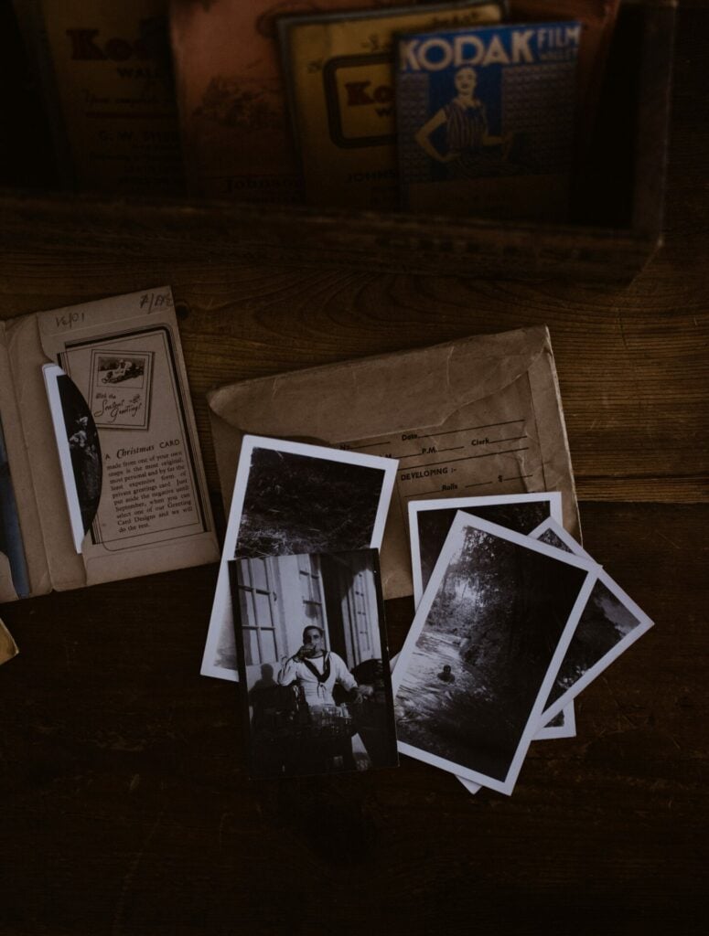 picture of black-and-white photographs scattered on a table